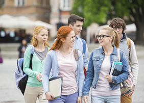 Group of college friends walking outdoors